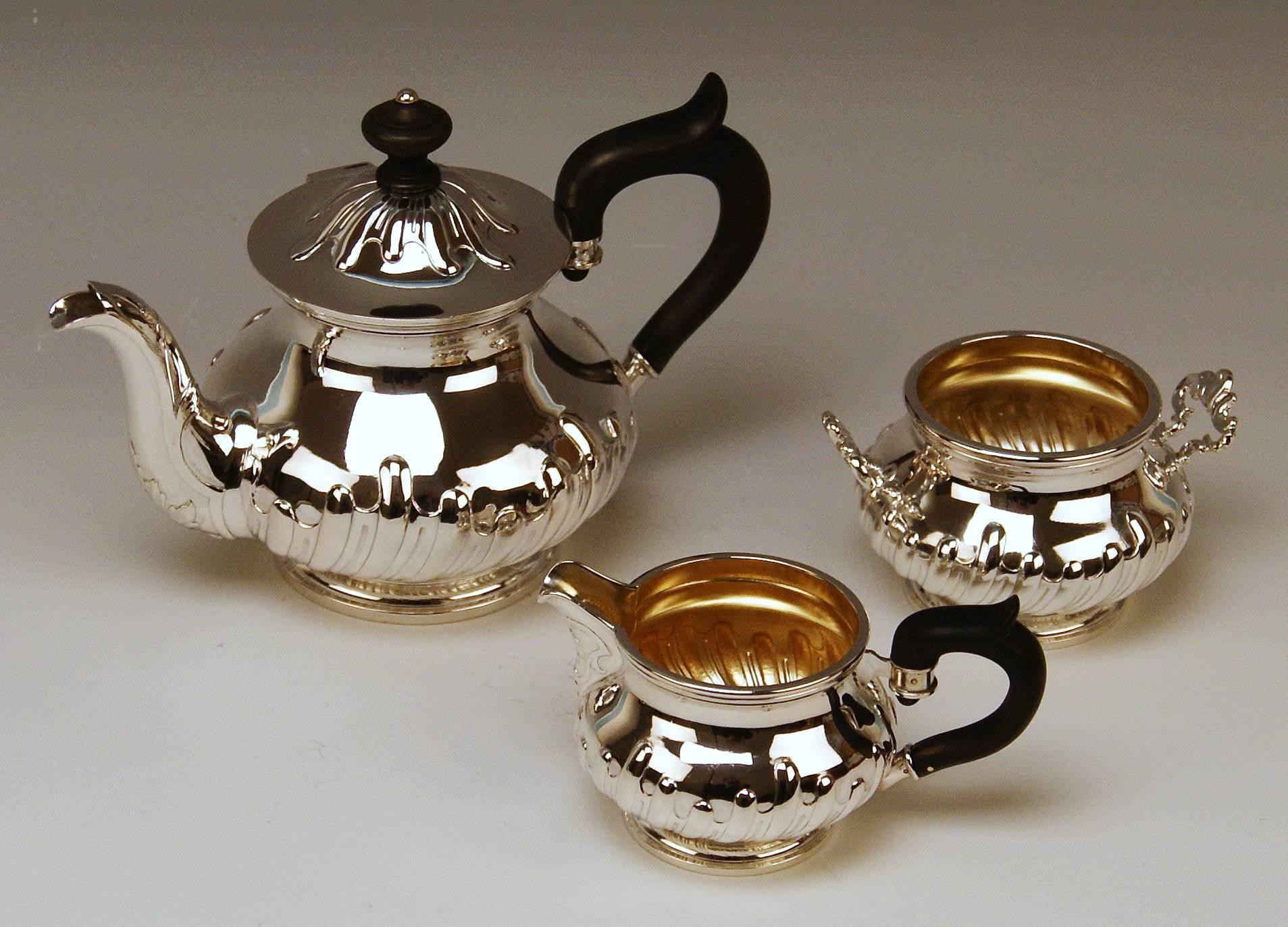 Silver Austrian gorgeous set of most elegant appearance:
-- Tea pot
-- Creamer
-- Sugar bowl
Manufactured circa 1870-1880

Items of this set are manufactured in baroque style which was typical for Viennese Historicism having taken place during
