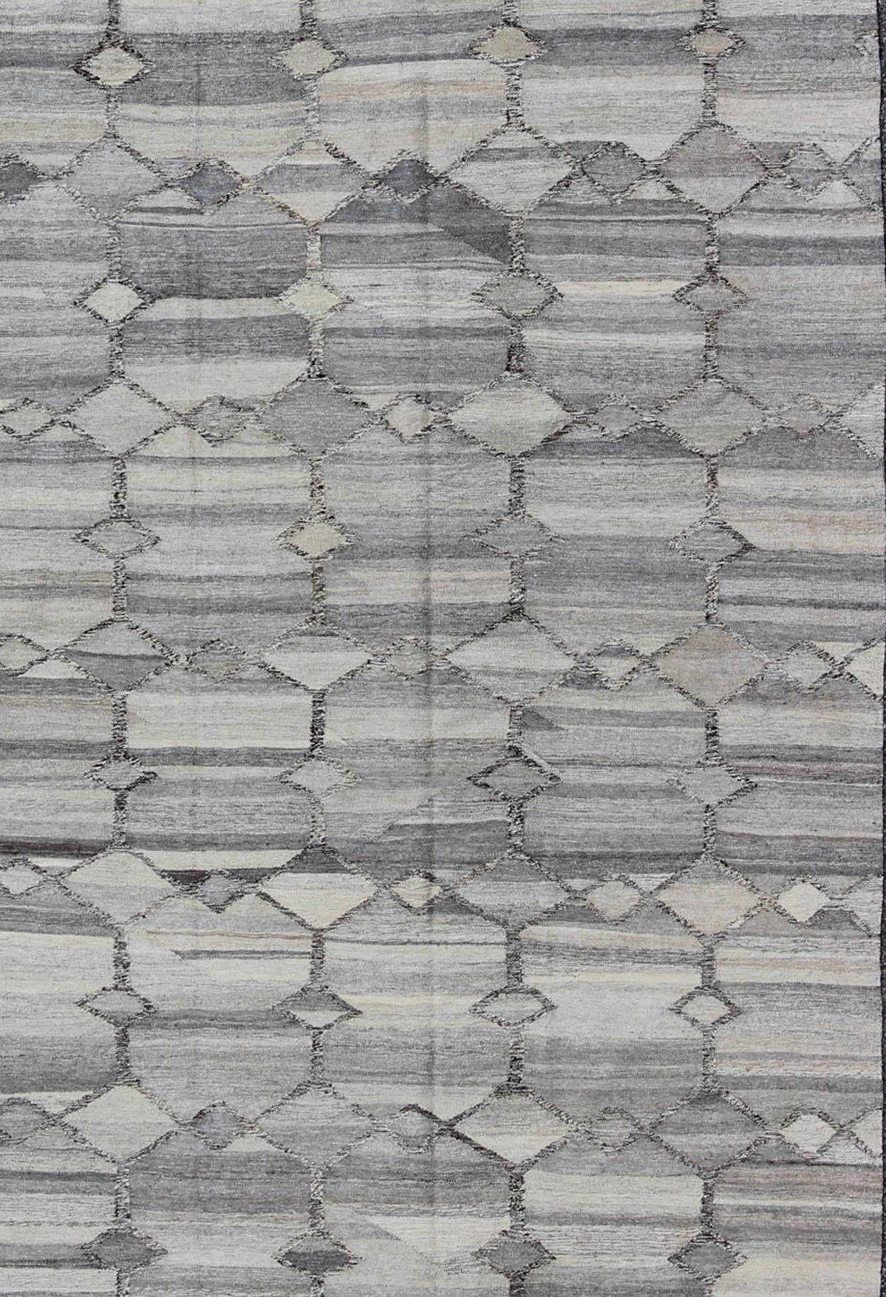 Versatile and neutral color-tone flat-weave Kilim for a Modern interiors as well a casual interiors. Keivan Woven Arts/ rug 17-0908, country of origin / type: Afghanistan / Kilim

Measures: 7'9 x 9'9

with a Minimalist floor design this silver