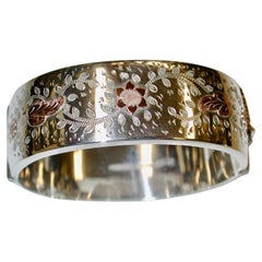Bangle in argento con incisione a mano e lavorazione in oro rosa Deakin & Francis 1963