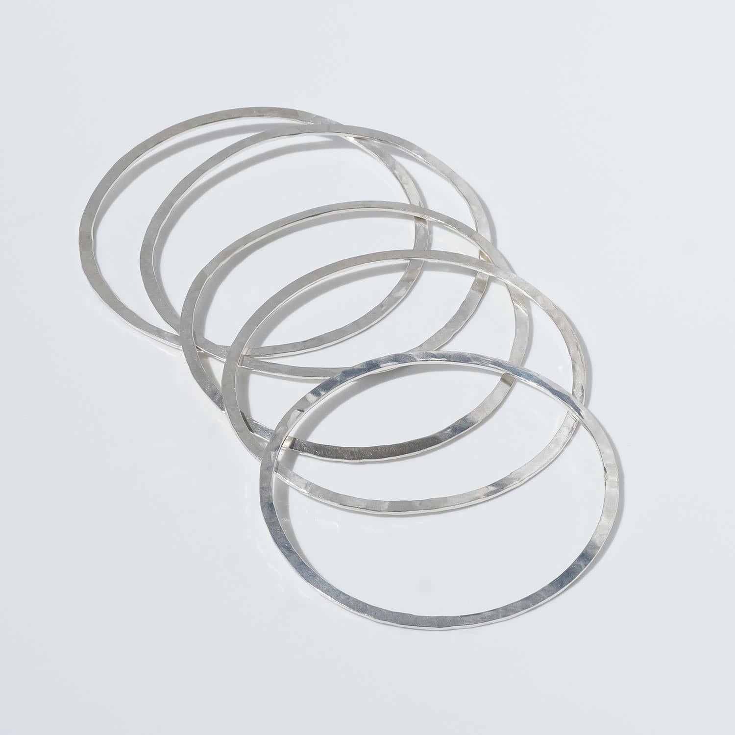 These five sterling silver bangles have a matt and partly hammered surface. They may be described as simple, smart and fashionable and they can be worn at the office, in school or for parties.

Do you know that Rey Urban opened his shop in