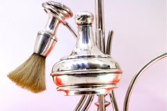 Silver barber hand mirror with perfumer, brush and cup