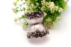 Silver base for egg holder with floral reliefs