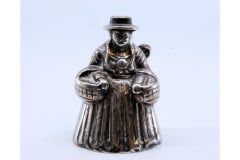 Silver bell in South American style with native woman carrying child