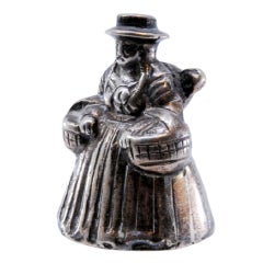 Silver bell in South American style with native woman carrying child