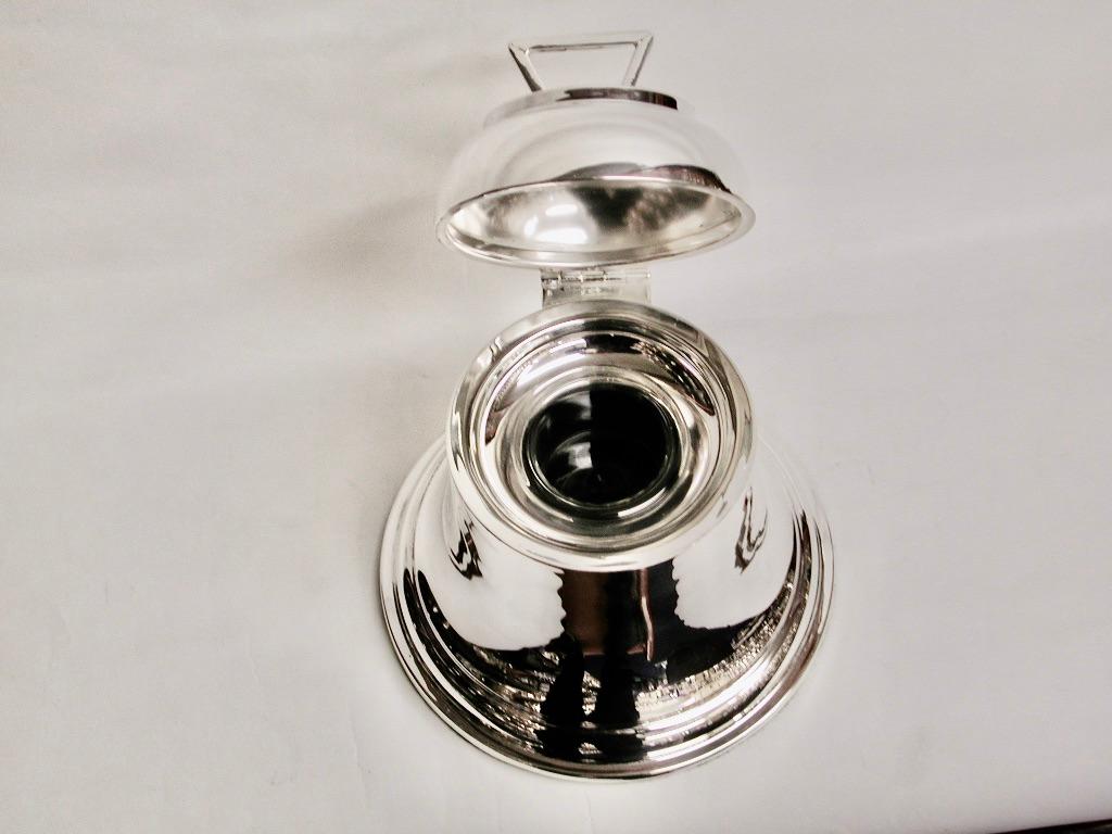 Silver bell Inkstand, dated 1913, A & J Zimmermann, Birmingham
Large bell shaped inkstand with clear glass liner.
This particular inkpot is 6 inches high with a diameter at the base of
5.5 inches.