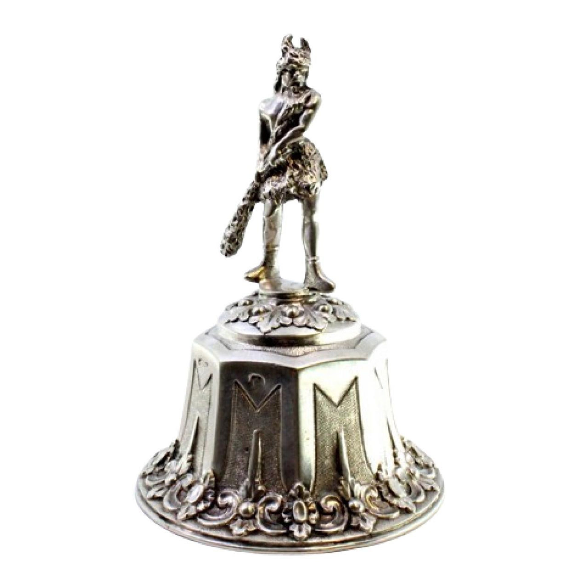 Silver bell w/ a barbarian warrior figure on a pedestal w/ reliefs 
garlands For Sale