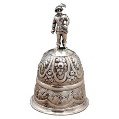 Silver bell with embossed floral motifs