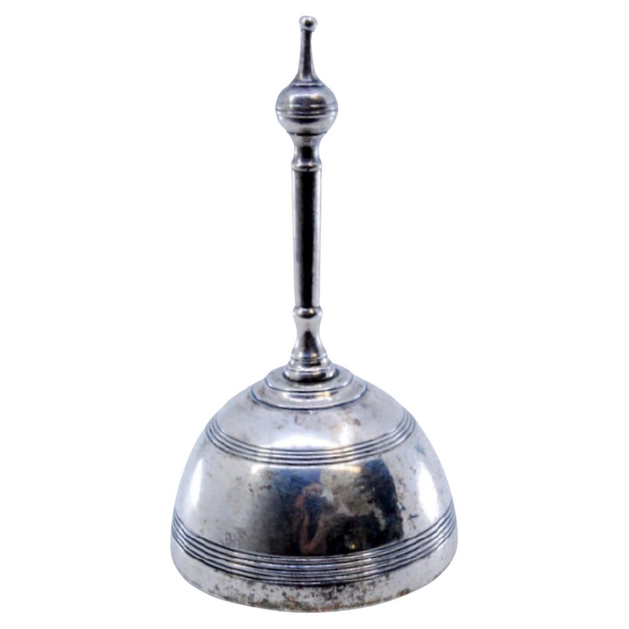 Silver bell with friezes around it and topped with a ball For Sale