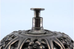 Silver bell with pierced floral lid, mechanism and four feet