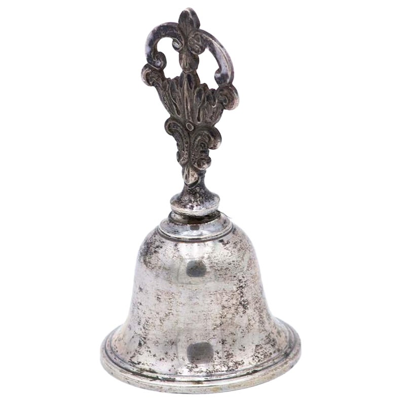 Silver bell with relief and cut handle