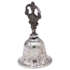 Silver bell with relief and cut handle