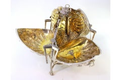 Silver biscuit shell bowl w/ reliefs, gold interior & 3 claw feet