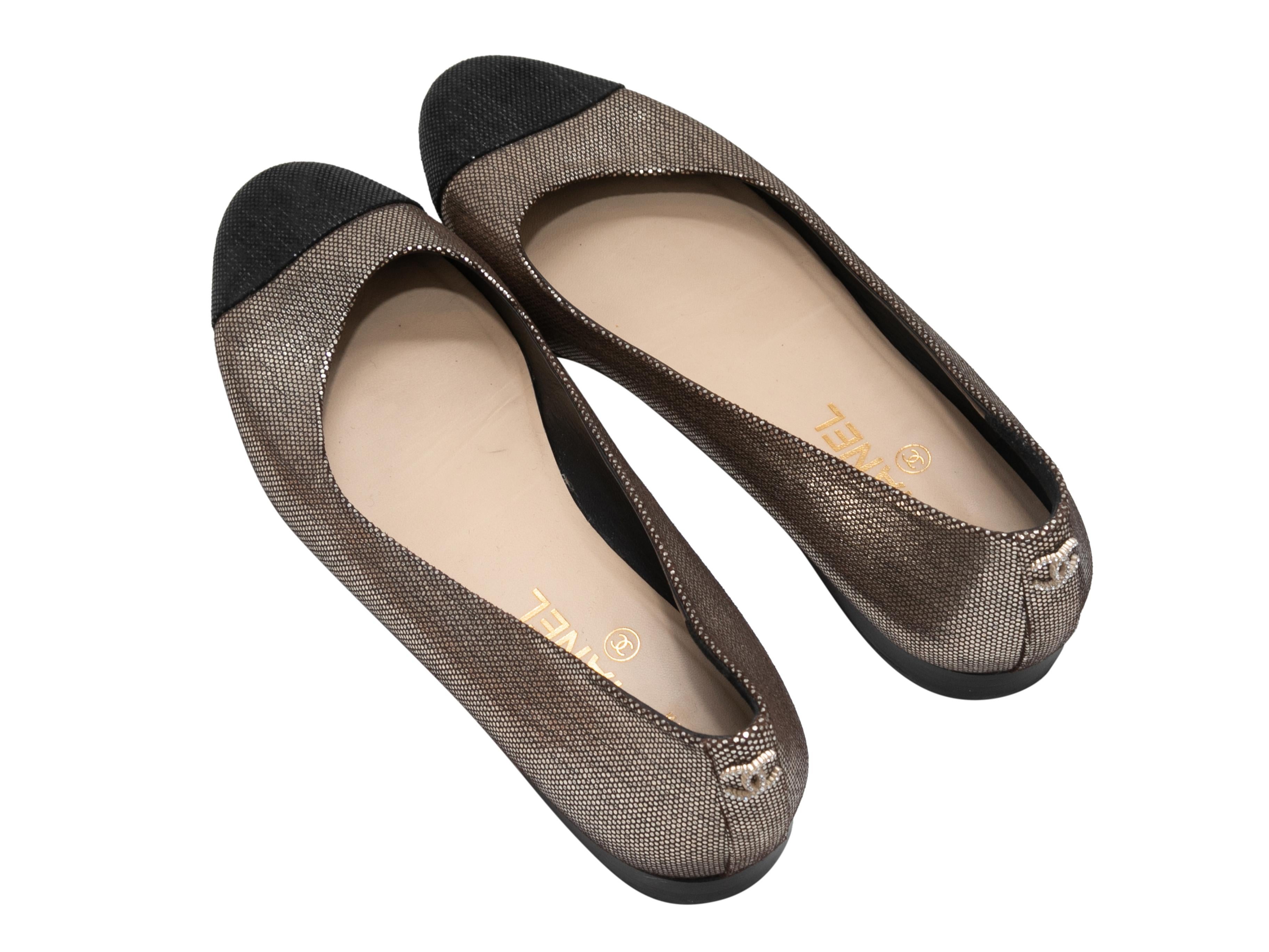Silver and black metallic cap-toe ballet flats by Chanel. Crystal-embellished CC adornments  at counters. 0.5