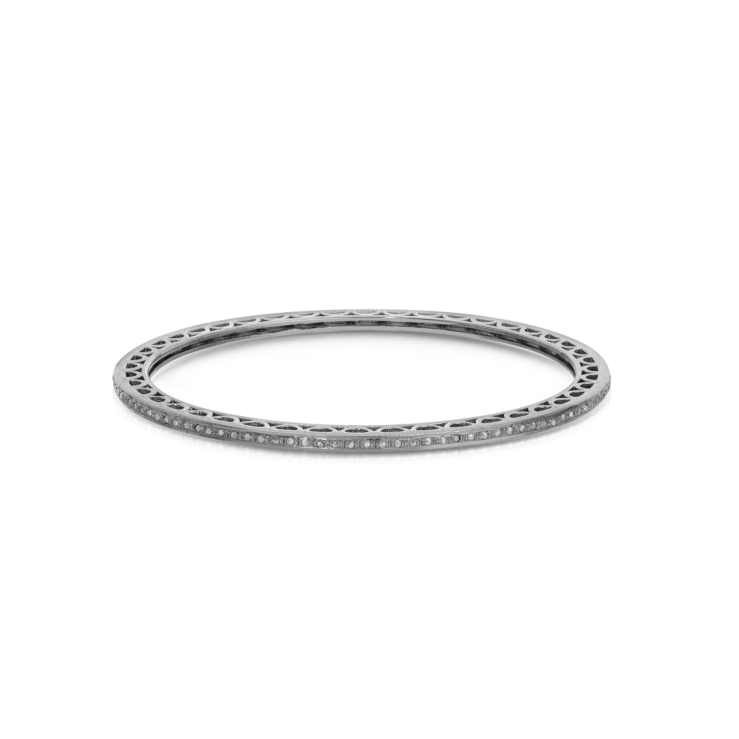 A fully set Diamond bangle featuring .80 Carats of White Diamonds set in Blackened Silver on contemporary bangle of Blackened Oxidized Silver... The ultimate in chic, stylish glamour alone or a perfect contrasting accompaniment to stacks of bangles