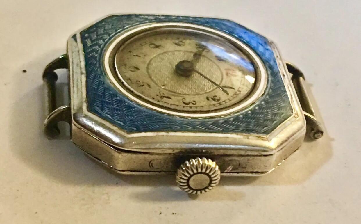 This beautiful blue enamel silver Swiss trench watch is finely made and it’s in good working condition.