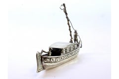 Silver boat with applications and relief figures