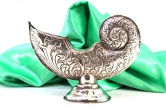 Silver boat with reliefs and applications, set on a circular base with friezes