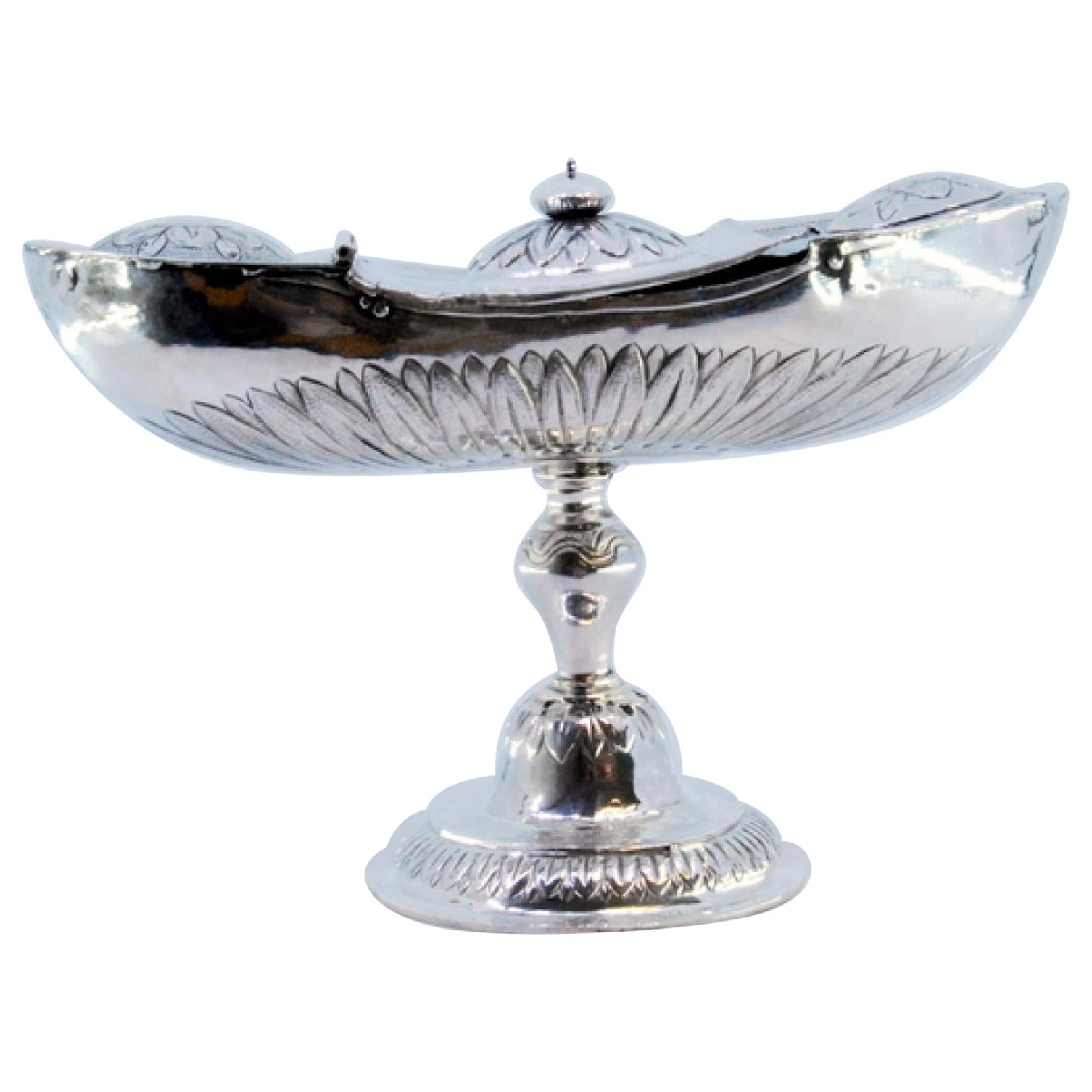 Silver boat with reliefs and applications, set on a round, engraved base