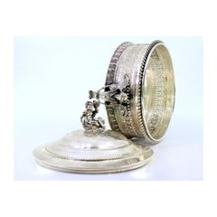 Silver bonbon jar w/ grid cut, pearly frieze, angels & knobbed lid