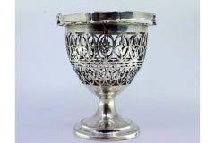 Silver bonbonette box w/ a tilting handle & placed on a round base w/ friezes