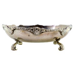 Silver bonbonette box w/ raised friezes 
3-flower knob on 3 palm feet