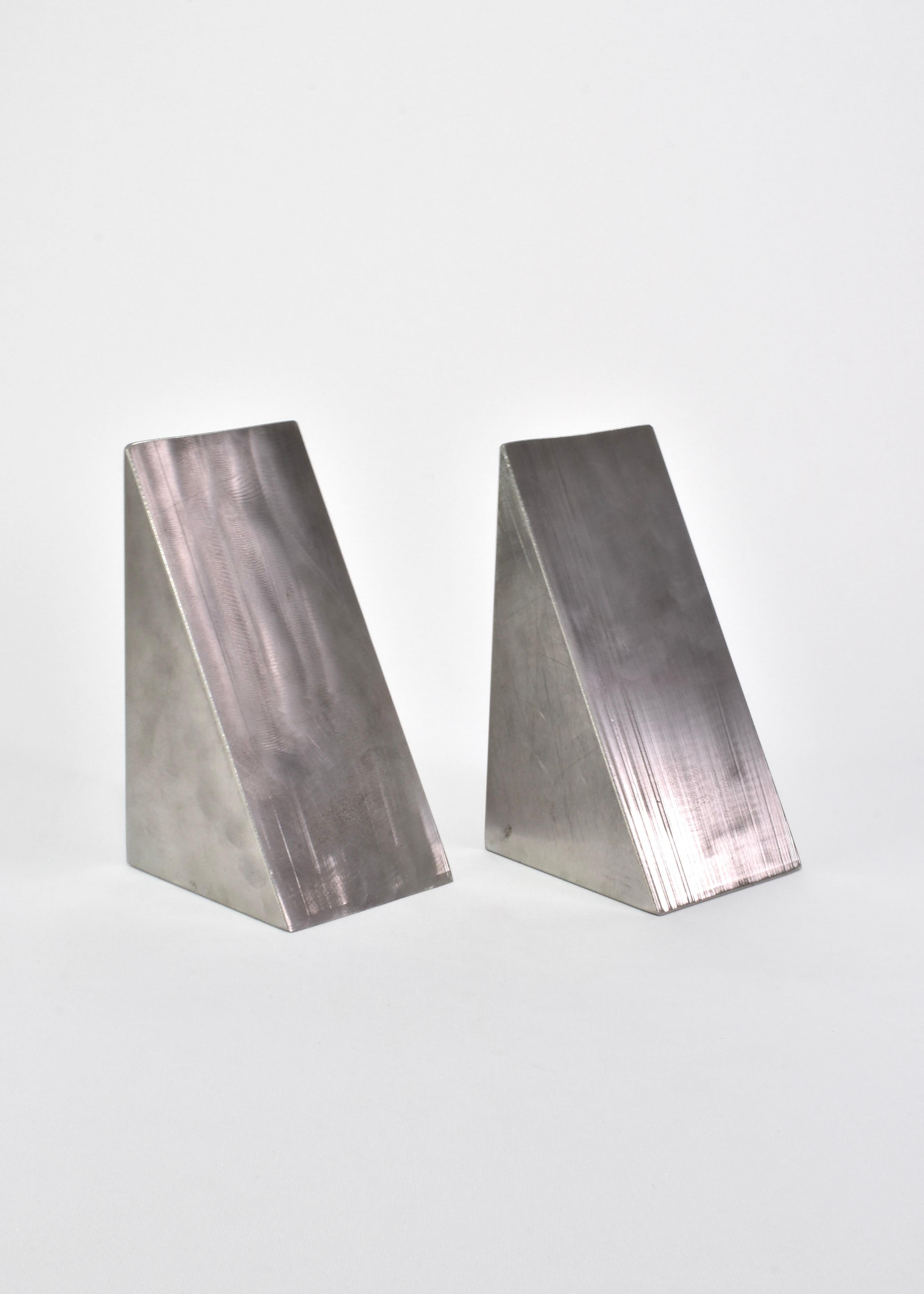 Sculptural vintage bookends in solid steel, set of two.

Please note these are very heavy, each weighs 20 pounds and will be shipped in a custom wooden box.