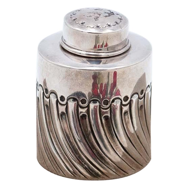 Silver bottle with spiral reliefs and removable lid