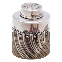 Silver bottle with spiral reliefs and removable lid