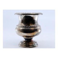 Silver bowl for flowers with reliefs on the surroundings