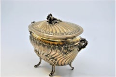 Silver bowl with embossed floral motifs and removable lid