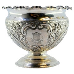 Antique Silver bowl with floral reliefs and a smooth round base