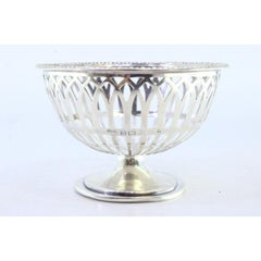 Silver bowl with friezes on the rim and placed on a circular base
