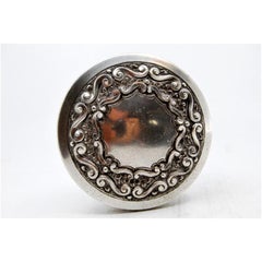 Silver box embossed on the lid with shells and on the casing