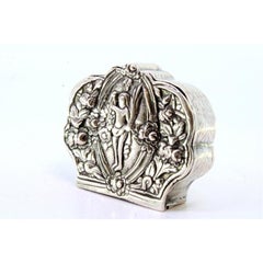 Silver box for rosaries with floral reliefs and nude figure