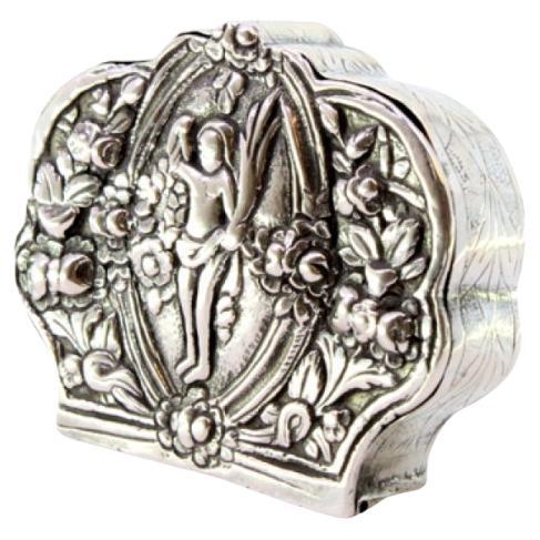Silver box for rosaries with floral reliefs and nude figure