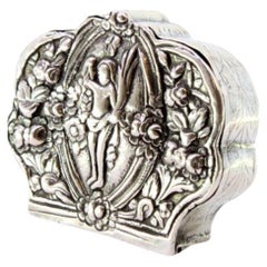 Silver box for rosaries with floral reliefs and nude figure