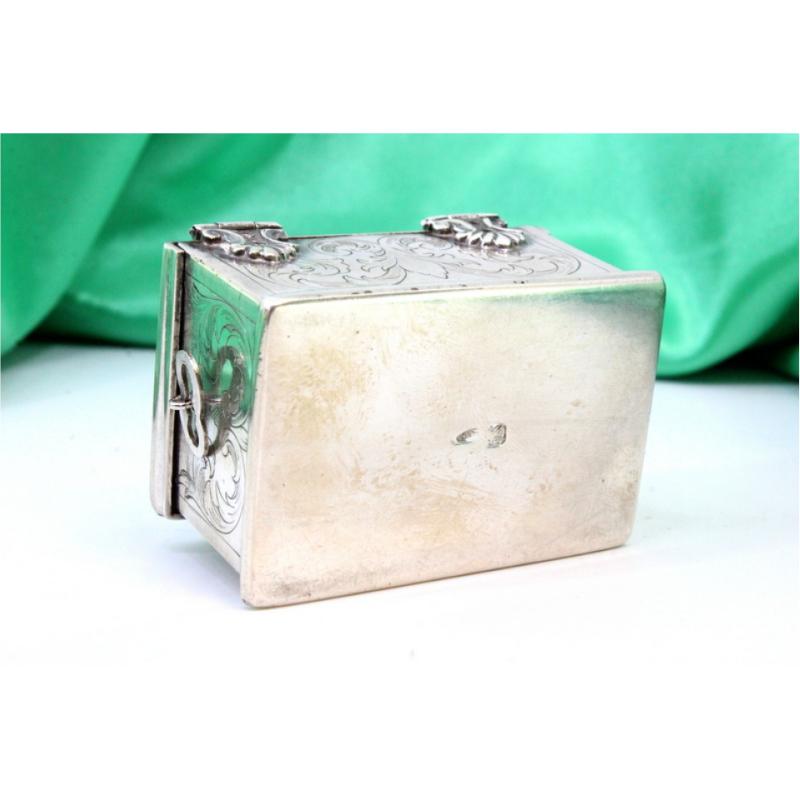 European Silver box in the shape of a chest w/ reliefs & applications w/ a hinged lid For Sale