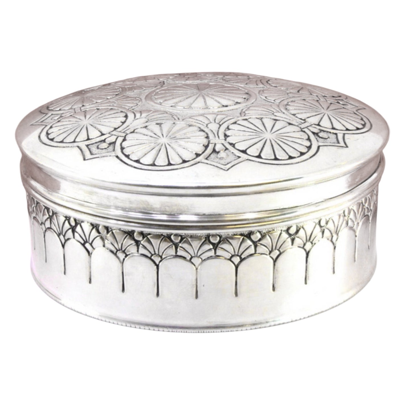 Silver box with concentric circles revealed on the removable lid