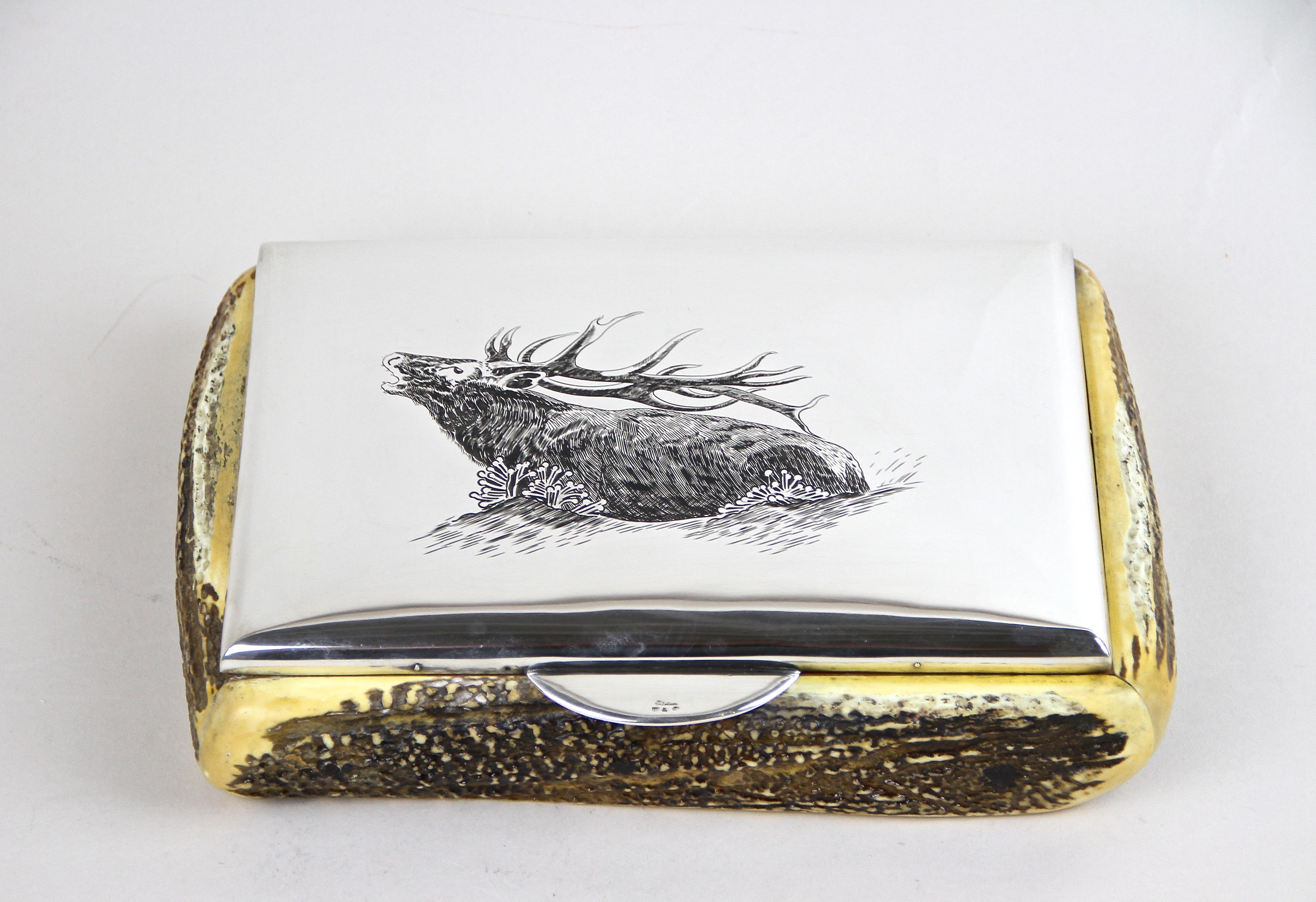 Extraordinary silver box with deer antler coverings elaborately made out of fine 900 Silver in Austria around 1920. This absolutely unique, hunting style box impress with gorgeous worked deer antler coverings and an amazing finely chased depiction