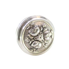 Silver box with embossed floral motifs on the removable lid and gold interior