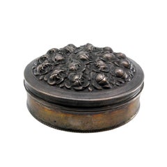 Silver box with embossed flowers on the lid and pearl trim