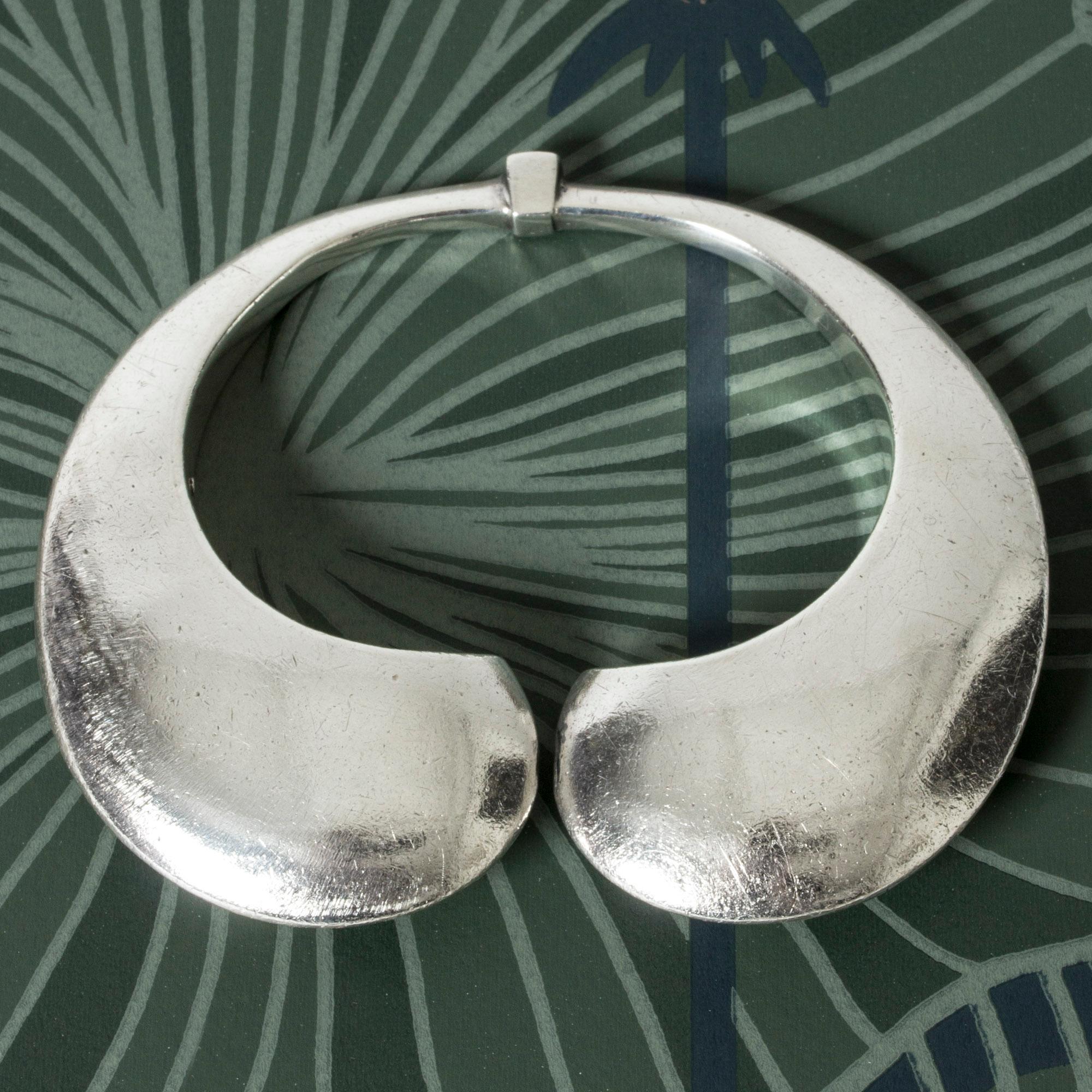 Striking silver bracelet by Olof Barve, in a bold, oversized design. Streamlined, organic lines, solid weight.

