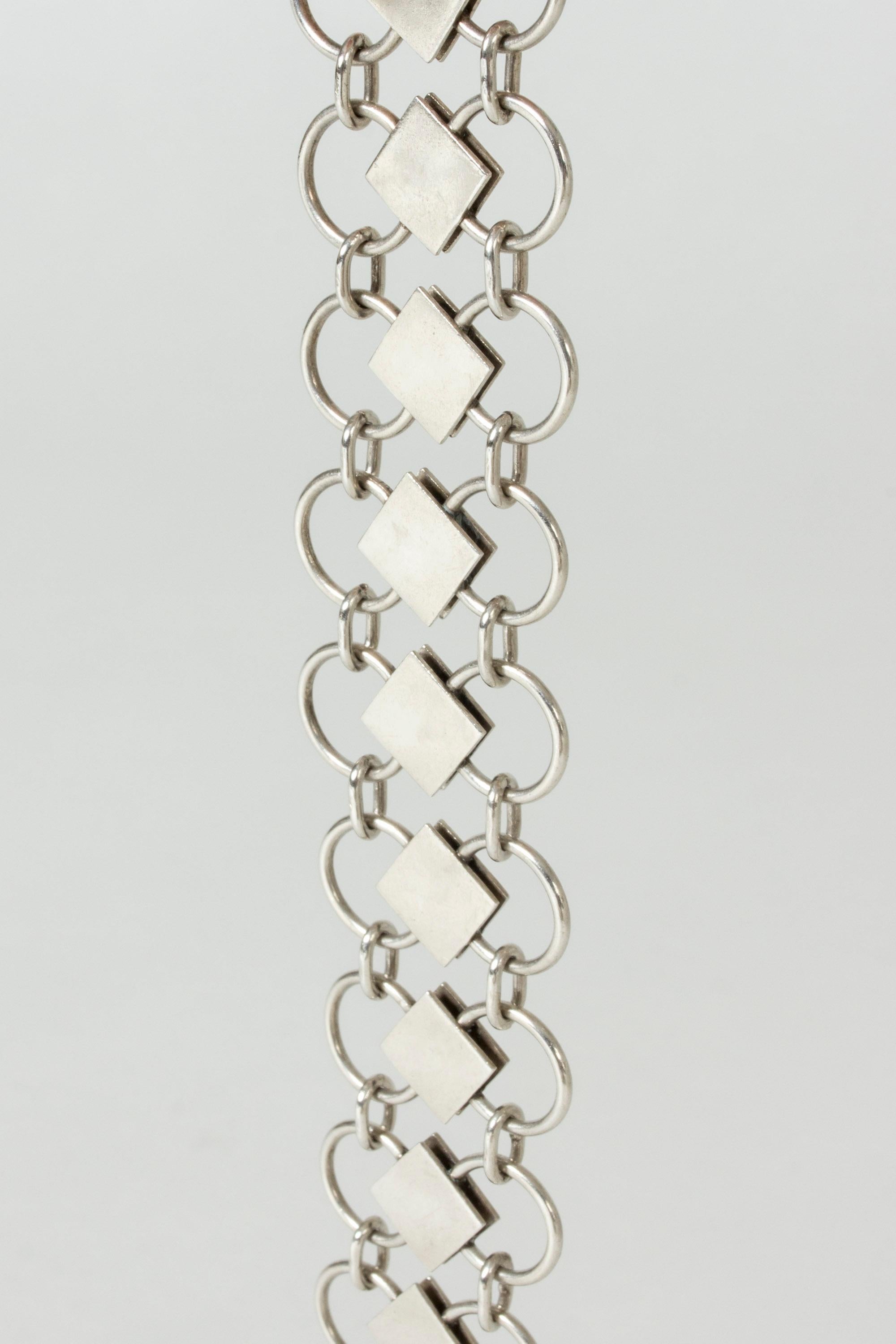 Striking silver bracelet by Sigurd Persson, with links in a clean, geometric design. Elegant play between the open circles and brushed square forms. Long length, easily shortened.