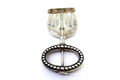 Silver bread fork with four engraved tines and pearled handle