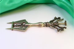 Silver bread fork with two engraved tines and floral appliqué handle