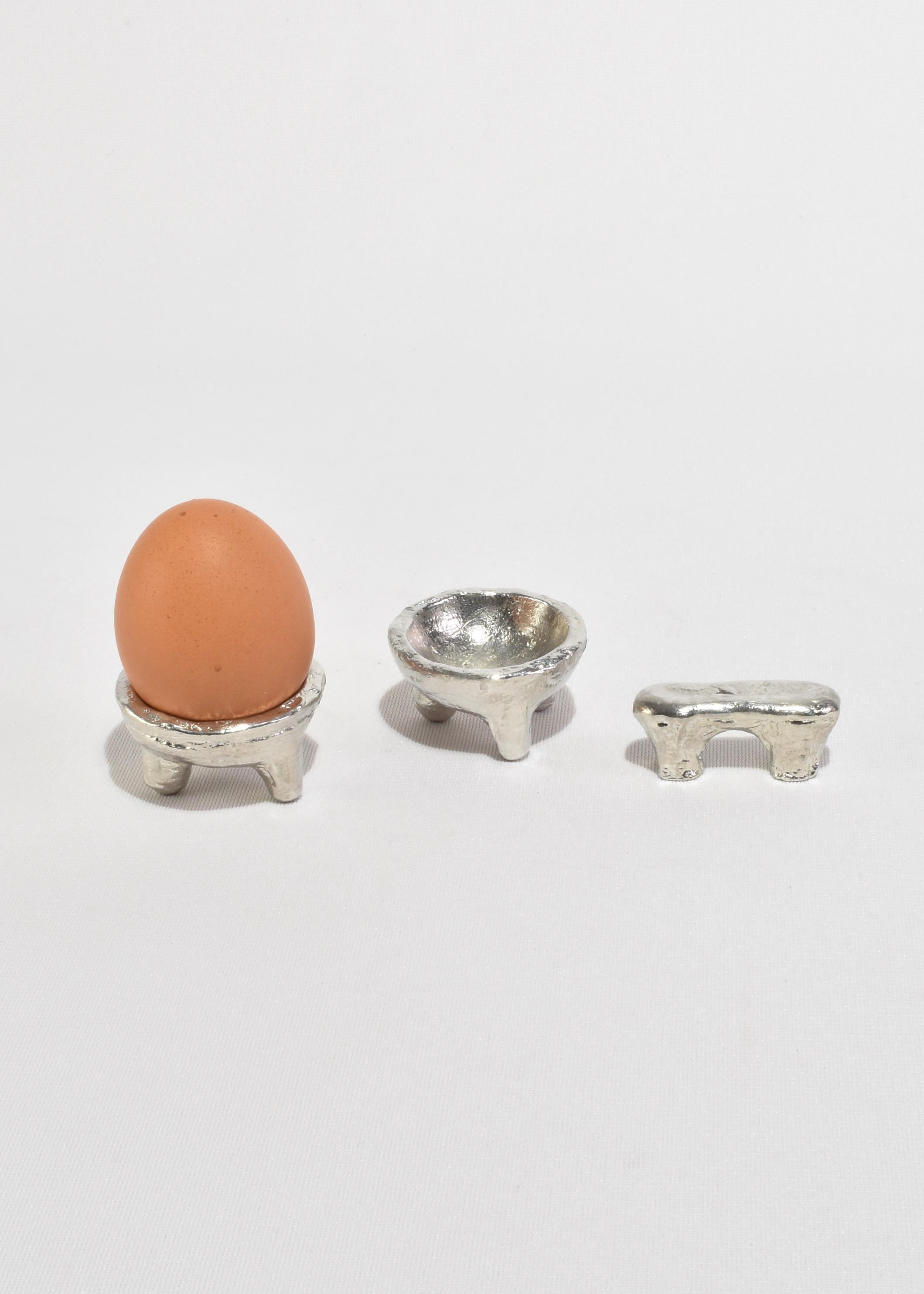 Handmade tin breakfast set by Sarah E. Haukka of Studio Formbart. This set includes one small cutlery stand to elegantly hold your spoon, and two small bowls which can be used for your eggs and salt.

Studio Formbart is a Stockholm-based conceptual