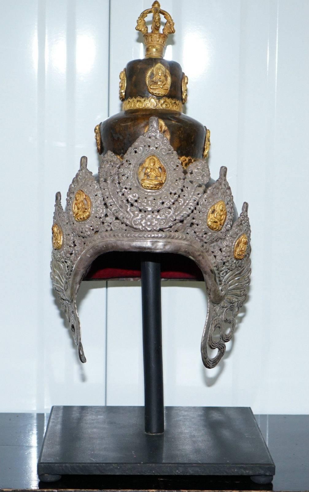 We are delighted to offer for auction this absolutely stunning very rare silver and old bronze Antique Buddhist Stupa Vajracharya Masters of Thunderbolt crown

Elaborate crowns of this type are worn by Vajracaryas, Buddhist priests when