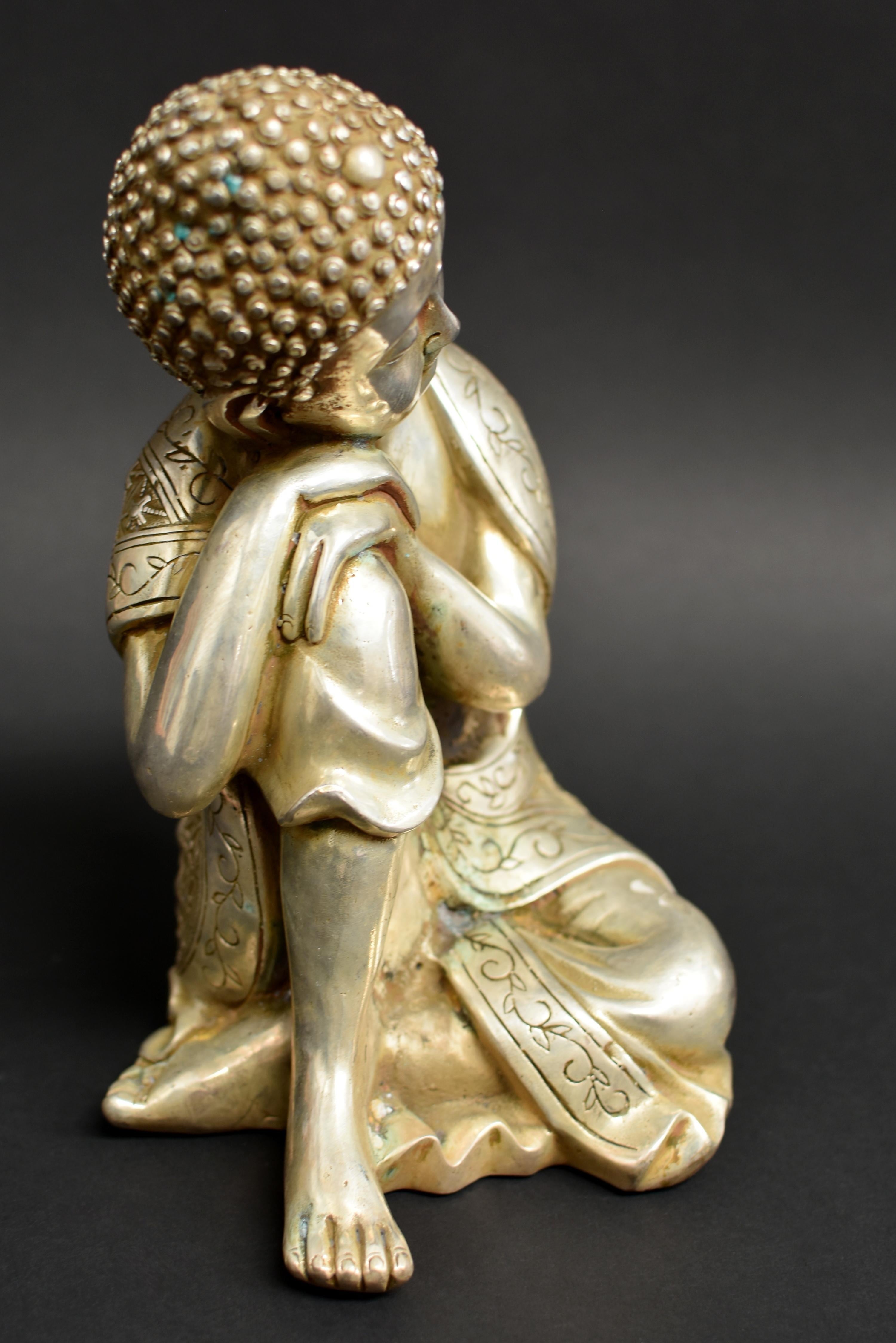 A large, beautiful statue weighing 6.4 lb depicting Buddha in contemplative, meditative mode. The broad face with closed eyes casting a serene aura, framed by long-lobed ears, beneath tightly coiled hair and surmounted by an ushnisha. Buddha wears a