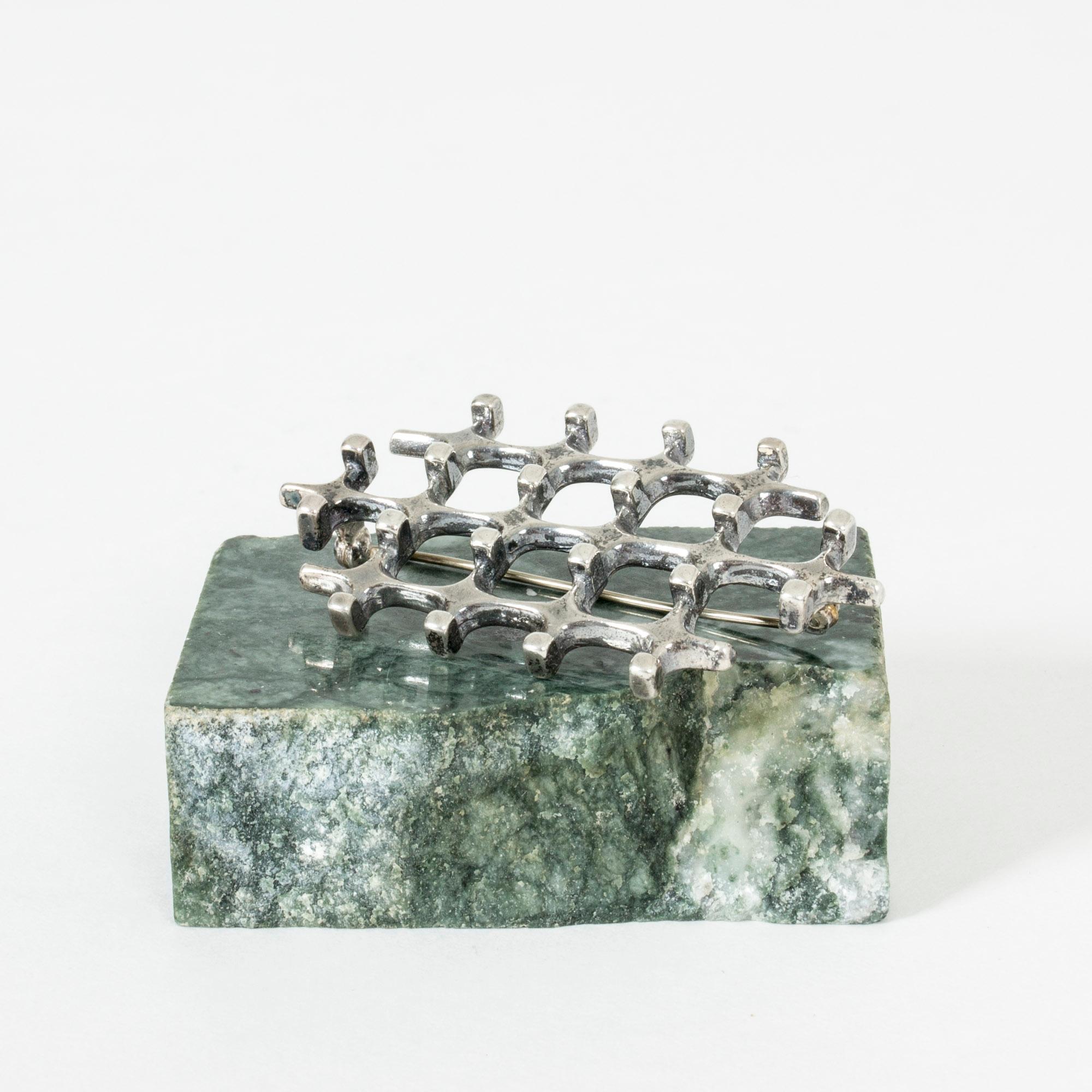 Striking geometric silver brooch by Marianne Berg. Heavy silver quality and rounded corners contrasting with the strict lines.

Dimensions: Length 5.8 cm, width 3.2 cm