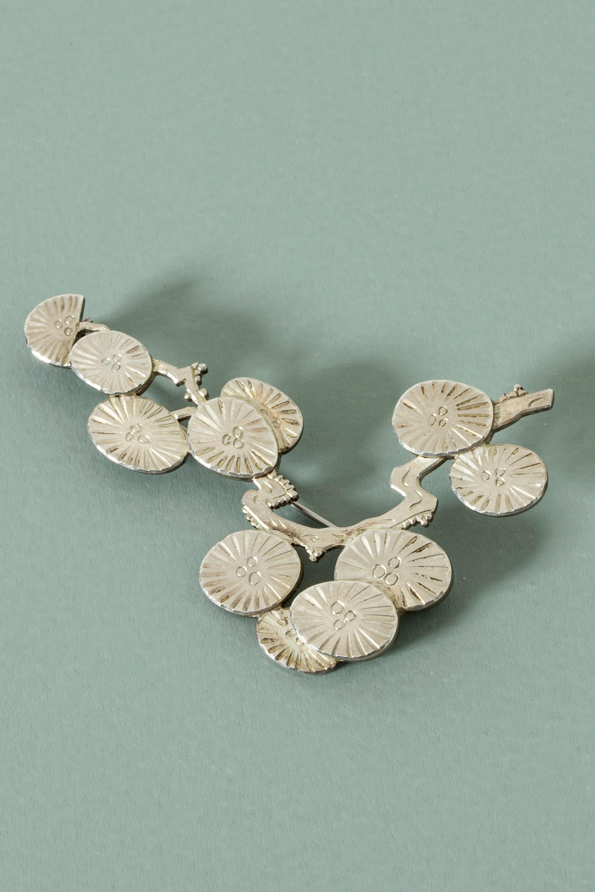 Beautiful silver brooch by Wiwen Nilsson, in the form of a blossoming cherry branch. A classic, elegant design with lovely attention to detail.
